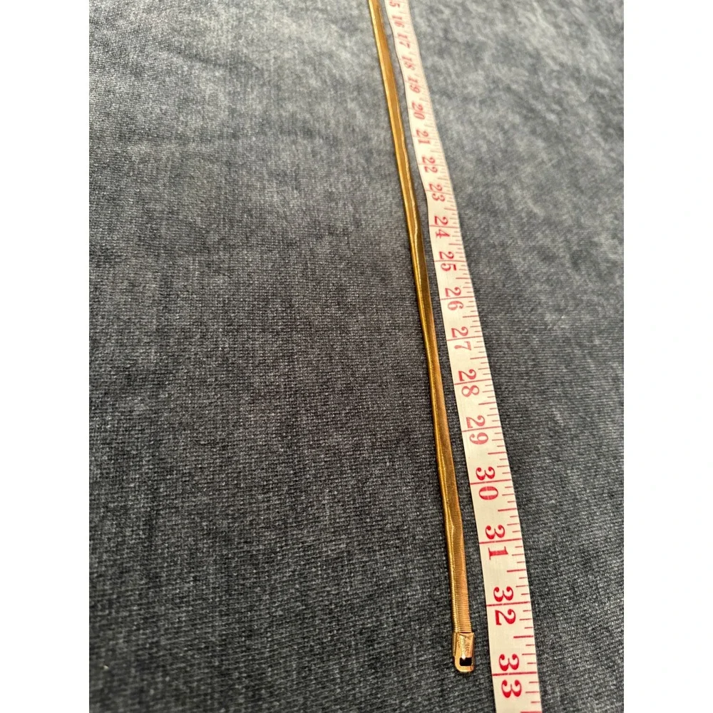 Juicy Couture Gold Skinny Stretch Belt Y2K Logo Plaque Metallic Cinch Accessory